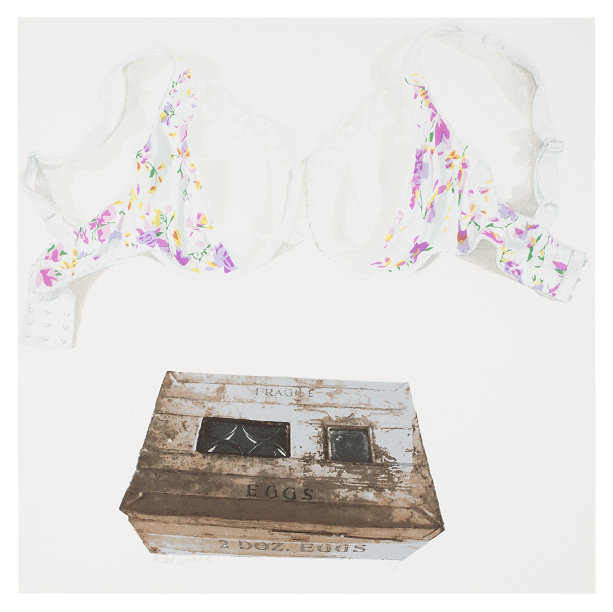 an empty brassiere above an antique egg box labeled “fragile.”