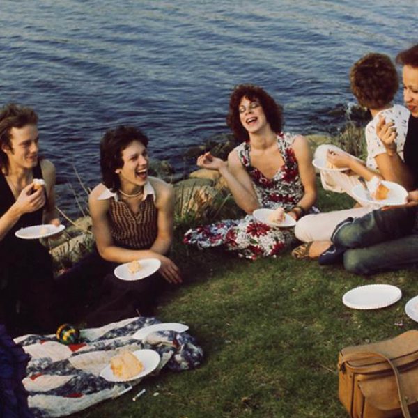 A group of people sitting in the water