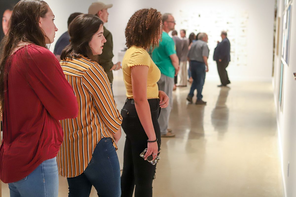 A group of people standing in a room
