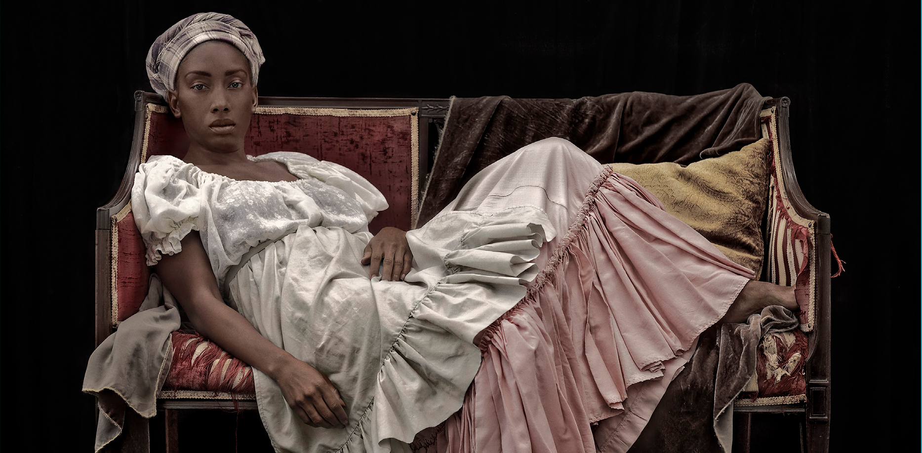 A person sitting on a bed