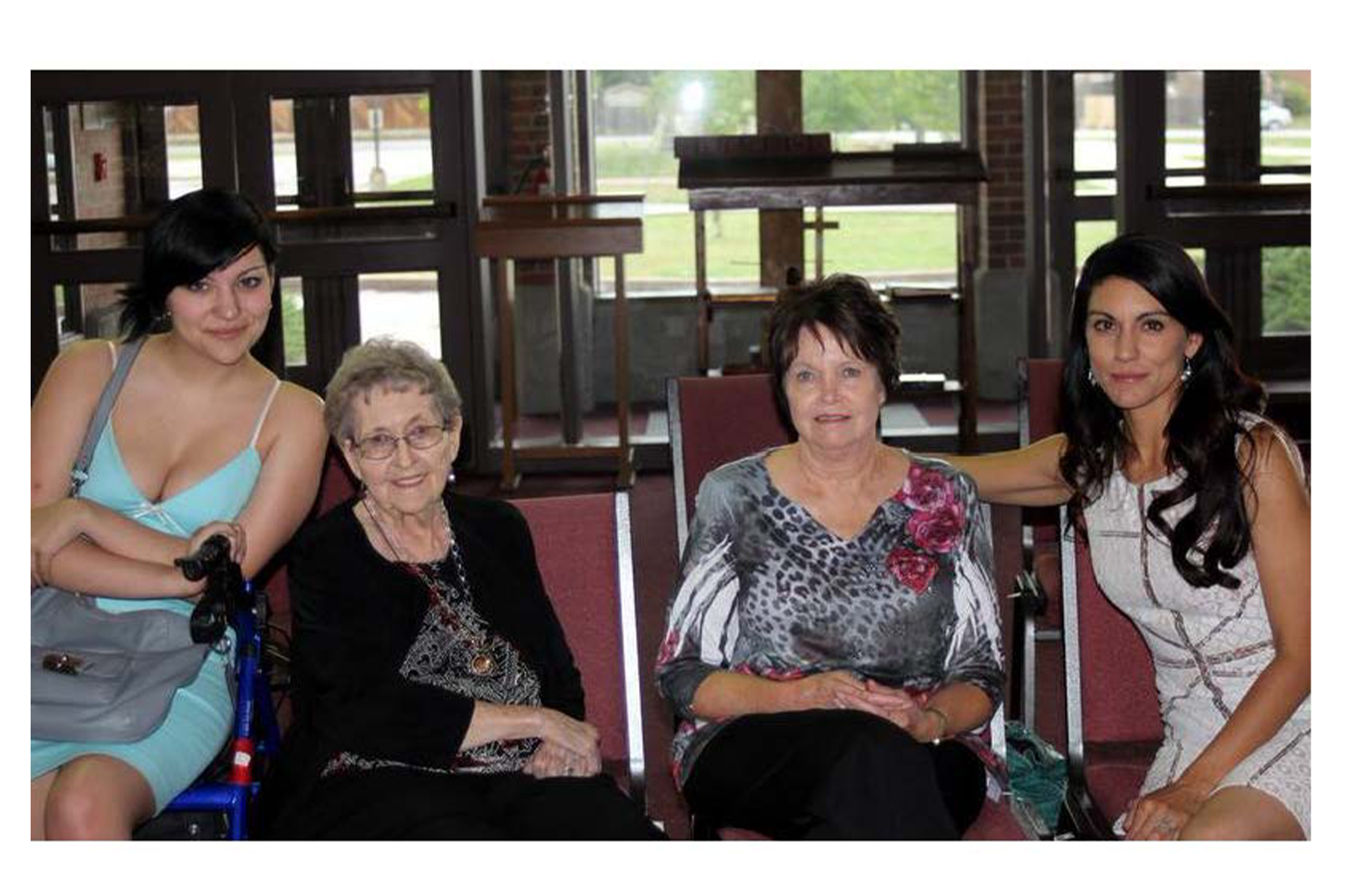 A group of people sitting posing for the camera