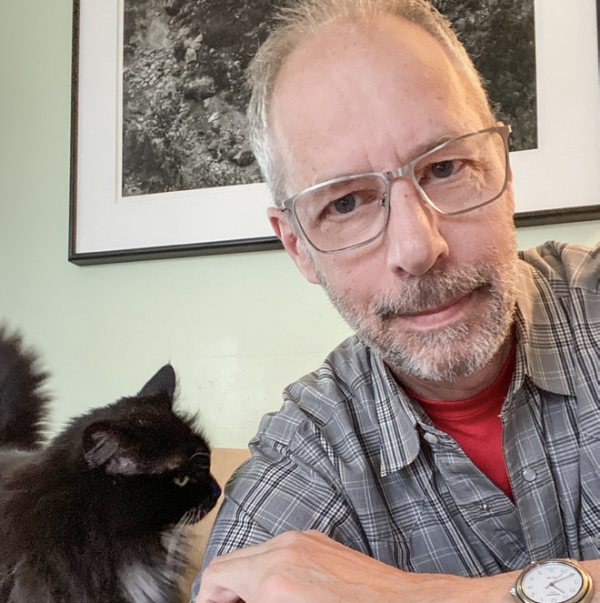 A man holding a cat