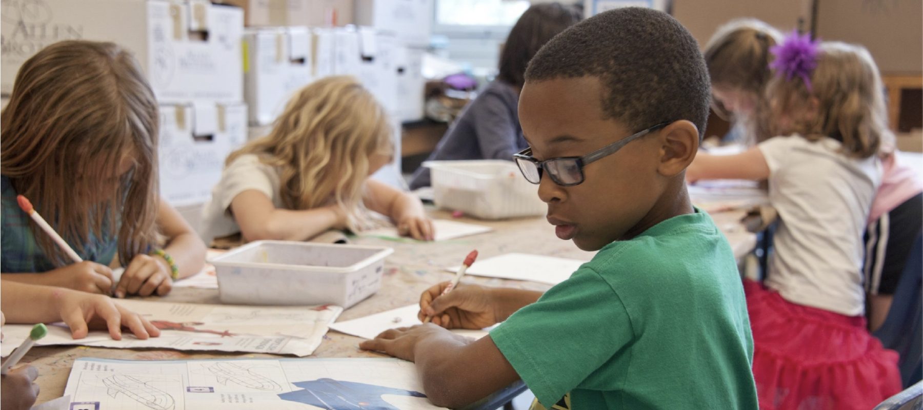 Young boy works on his school assignments.