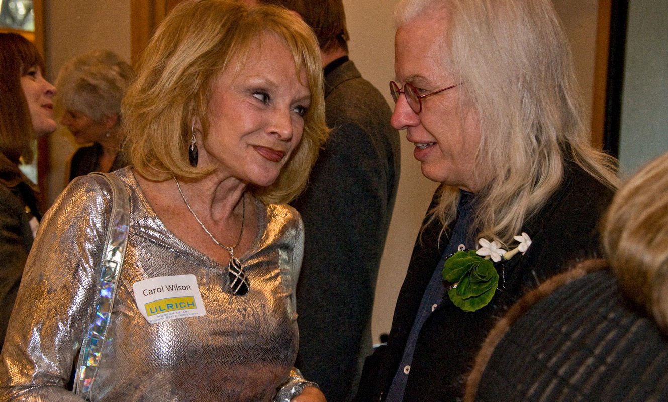 Two people talking in a room