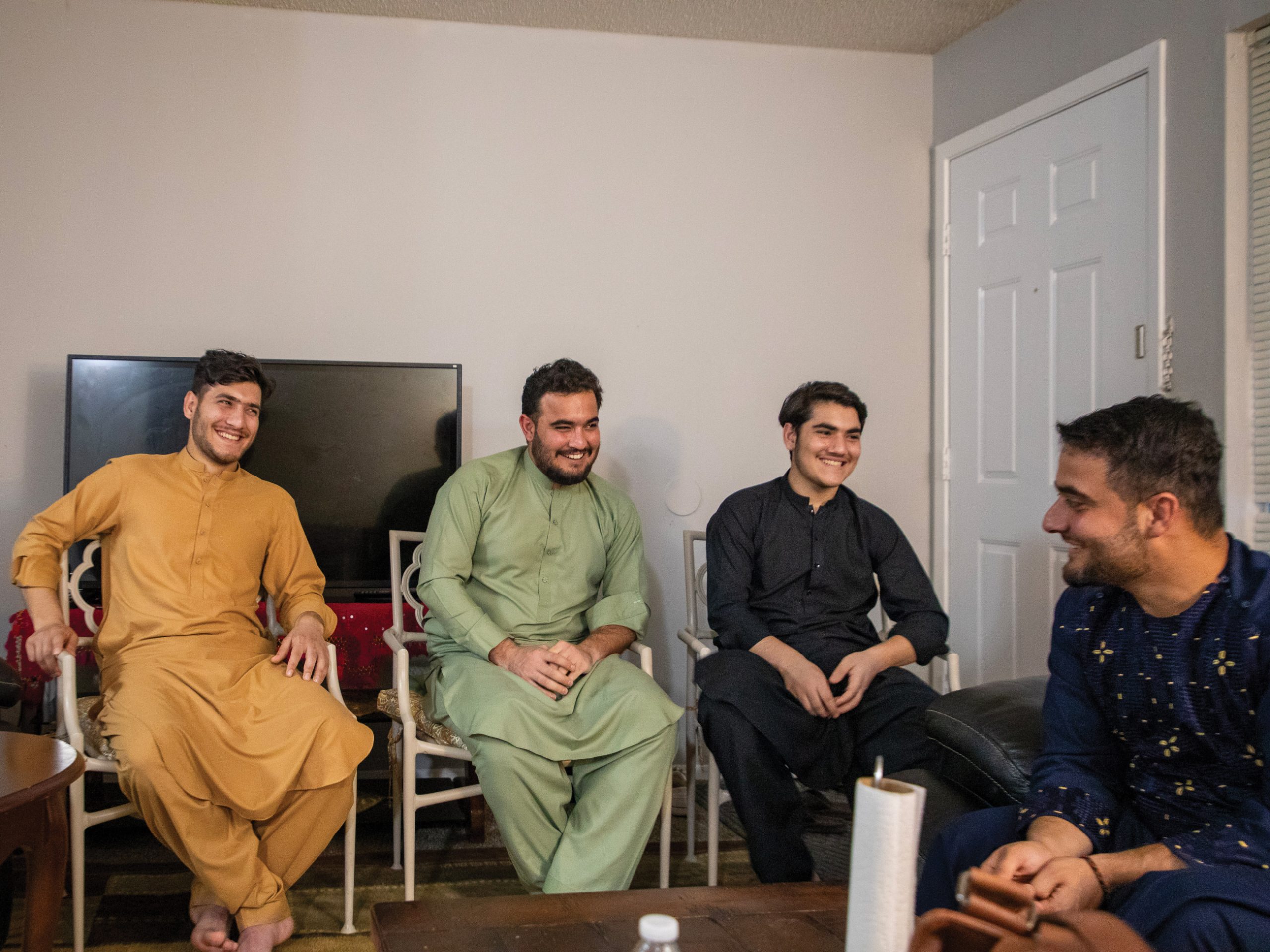 four seated mideastern men