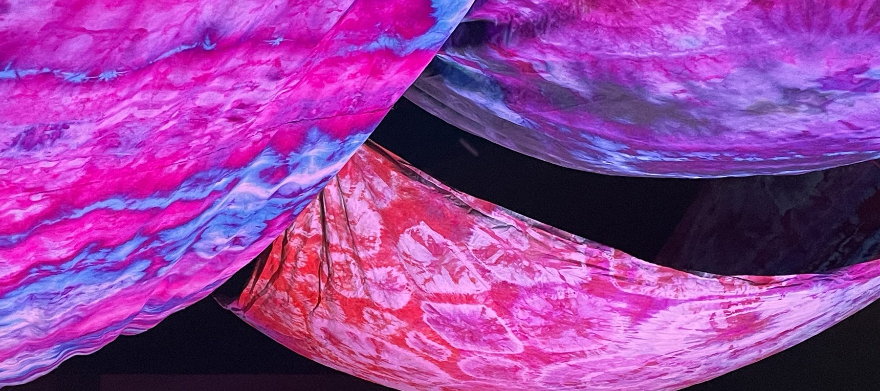 An art piece made with colorful tie-dyed fabric.