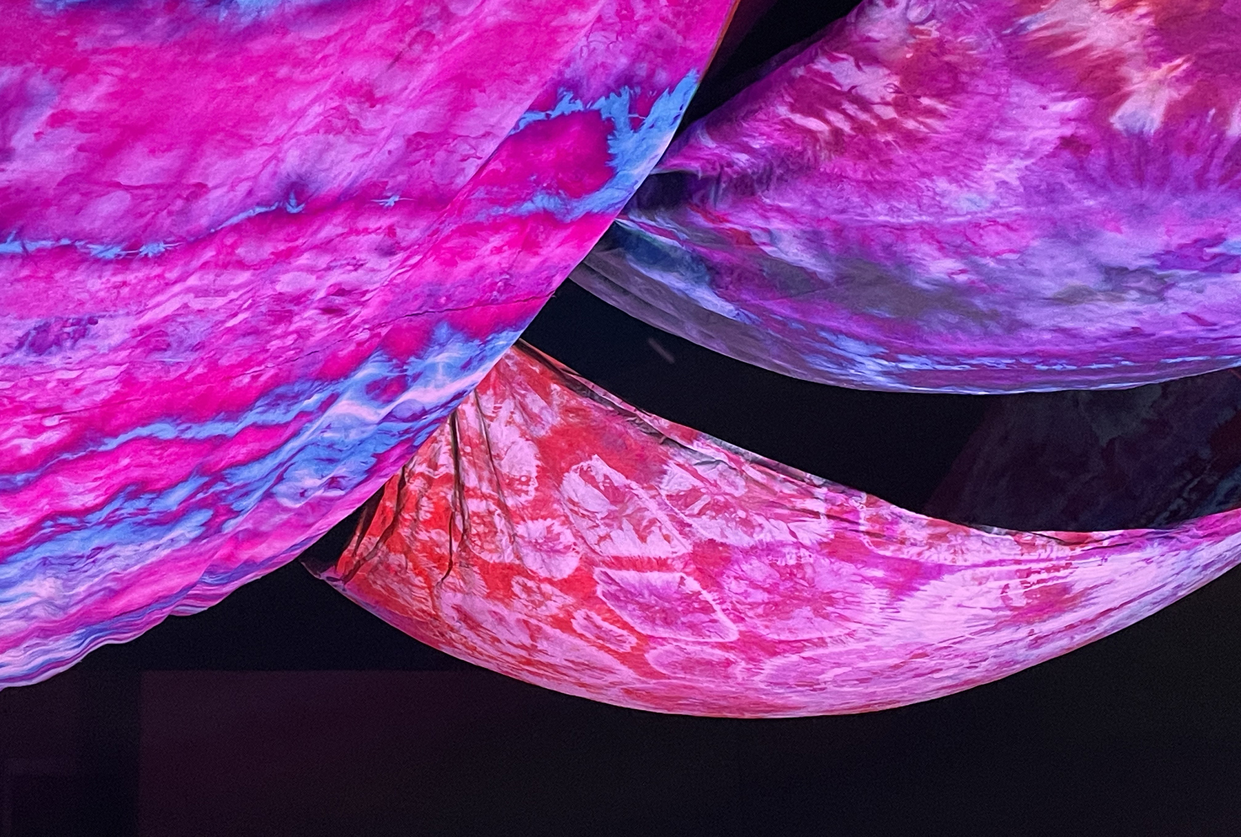 An art piece made with colorful tie-dyed fabric.